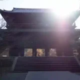 This photo is a panoramic view of the temple's Sanmon gate at Nanzen-Ji Temple. This gate is a massive wooden structure with a height of 22 meters.