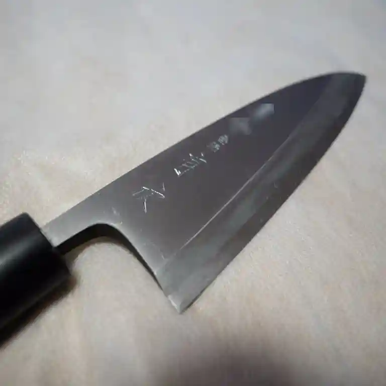 This picture shows a Deba bocho (pointed carving knife) I purchased at Aritsugu in Kyoto, Japan. I had my name engraved on the blade of the knife.