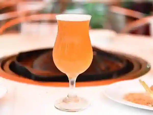 This image depicts a glass filled with KIRIN's Daydream craft beer.