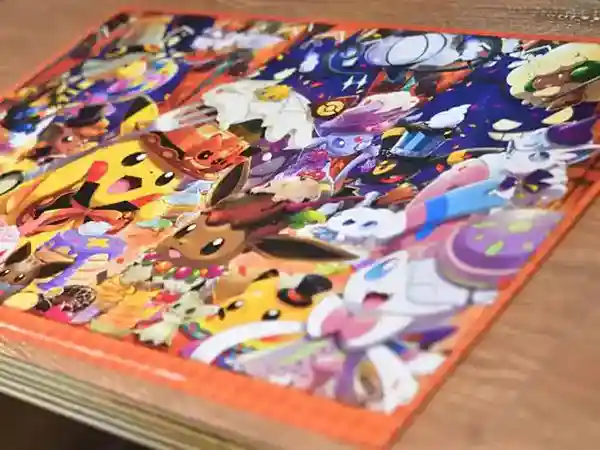 This photograph shows a Pokémon Café lunch mat displayed on a table. These lunch mats are only available during Halloween and feature Pokémon dressed in Halloween attire.