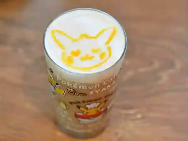 This picture shows a Halloween marron latte with Pikachu. Pikachu is depicted in the latte art on the drink. 